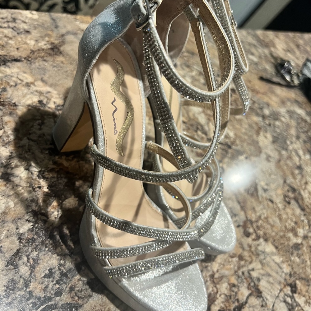 They are sparkly 4 1/2 inch heeled shoes that have only been worn once